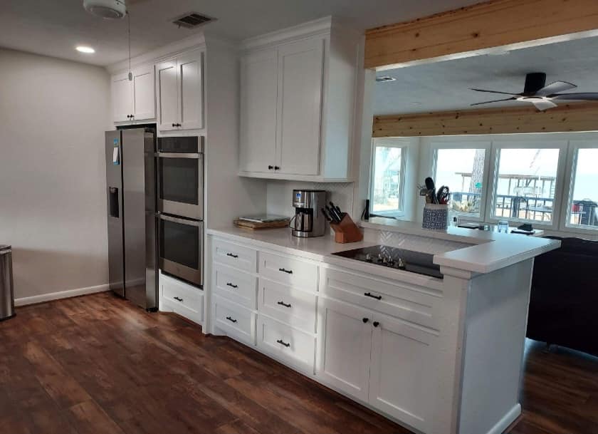 We installed custom cabinetry to help bring this dated kitchen back to life. 